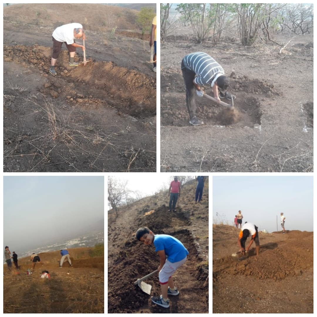 Volunteers digging trenches on hillside for Laghu Wan