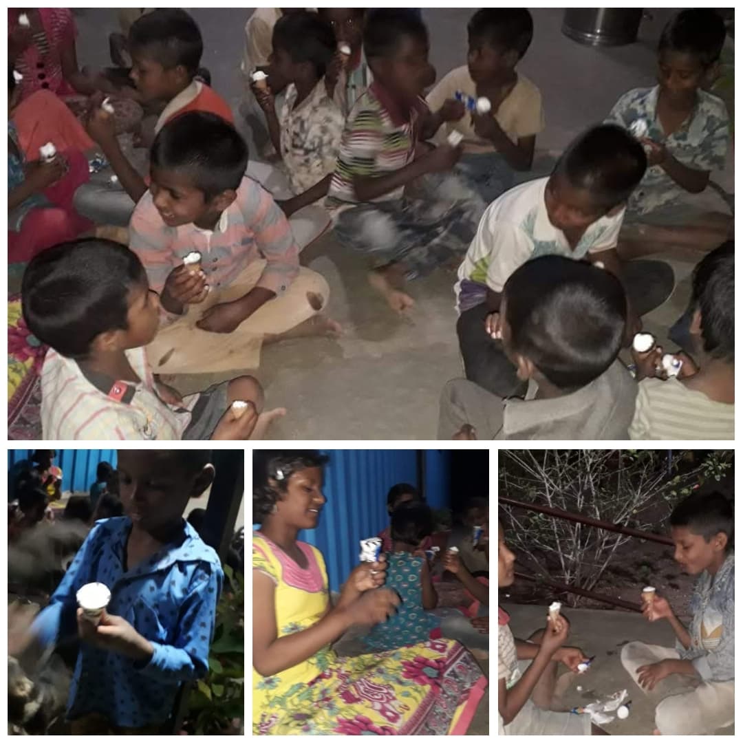 Children receiving food at community gathering